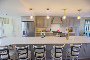 the completely remodeled kitchen in the manor house with seating for a large group