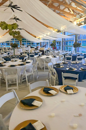 a round table is set with plates and silverware for a wedding